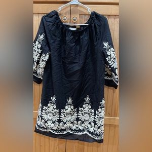 Like new black and white dress. Above knee cut